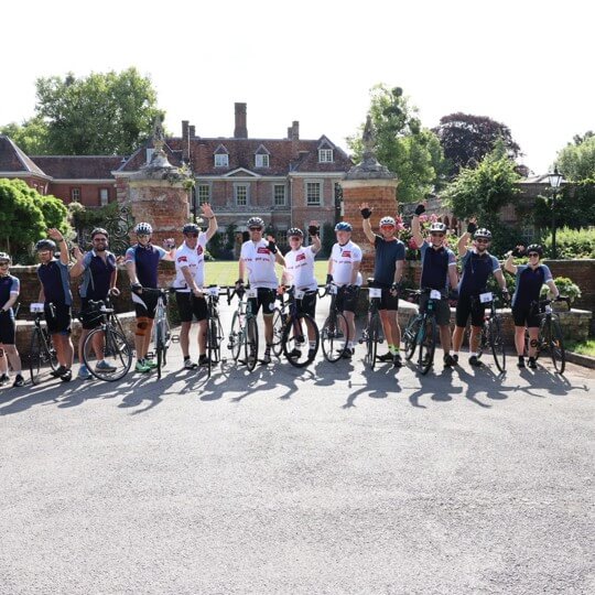 “Pedals - Hospitality Action Summer Cycle Challenge participants cycling in countryside”